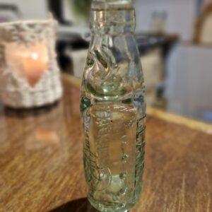 A Antique Buckleys Brewery bottle with marble stopper.